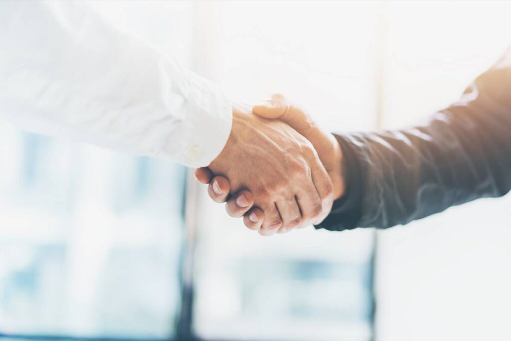 Photo of two men shaking hands