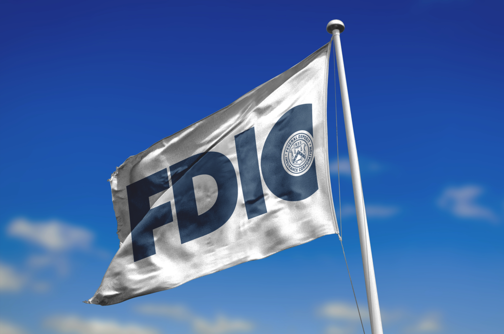 Photo of FDIC flag against a blue sky