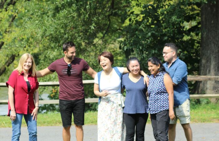 Six team members in a group photo at the company picnic