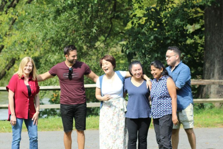 Six team members in a group photo at the company picnic