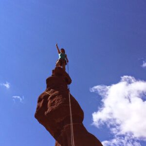 Mary climbing Ancient Art in Moab, Utah