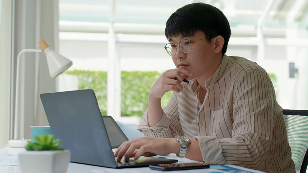 Young man working on his laptop.