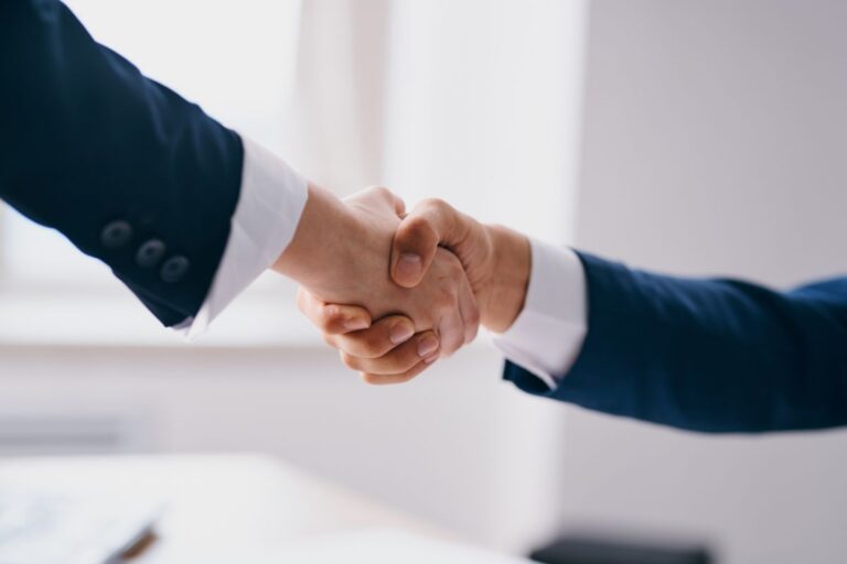 Two business people shaking hands
