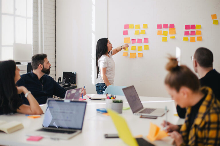 Team of workers collaborating in a conference room.